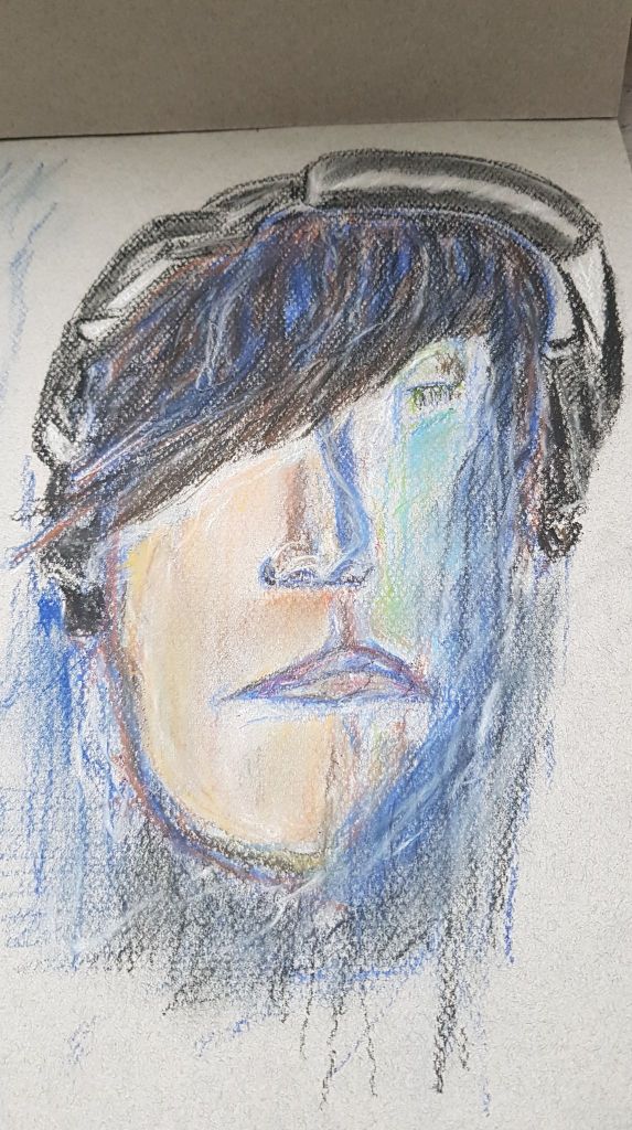 Half finished chalk pastel drawing of face